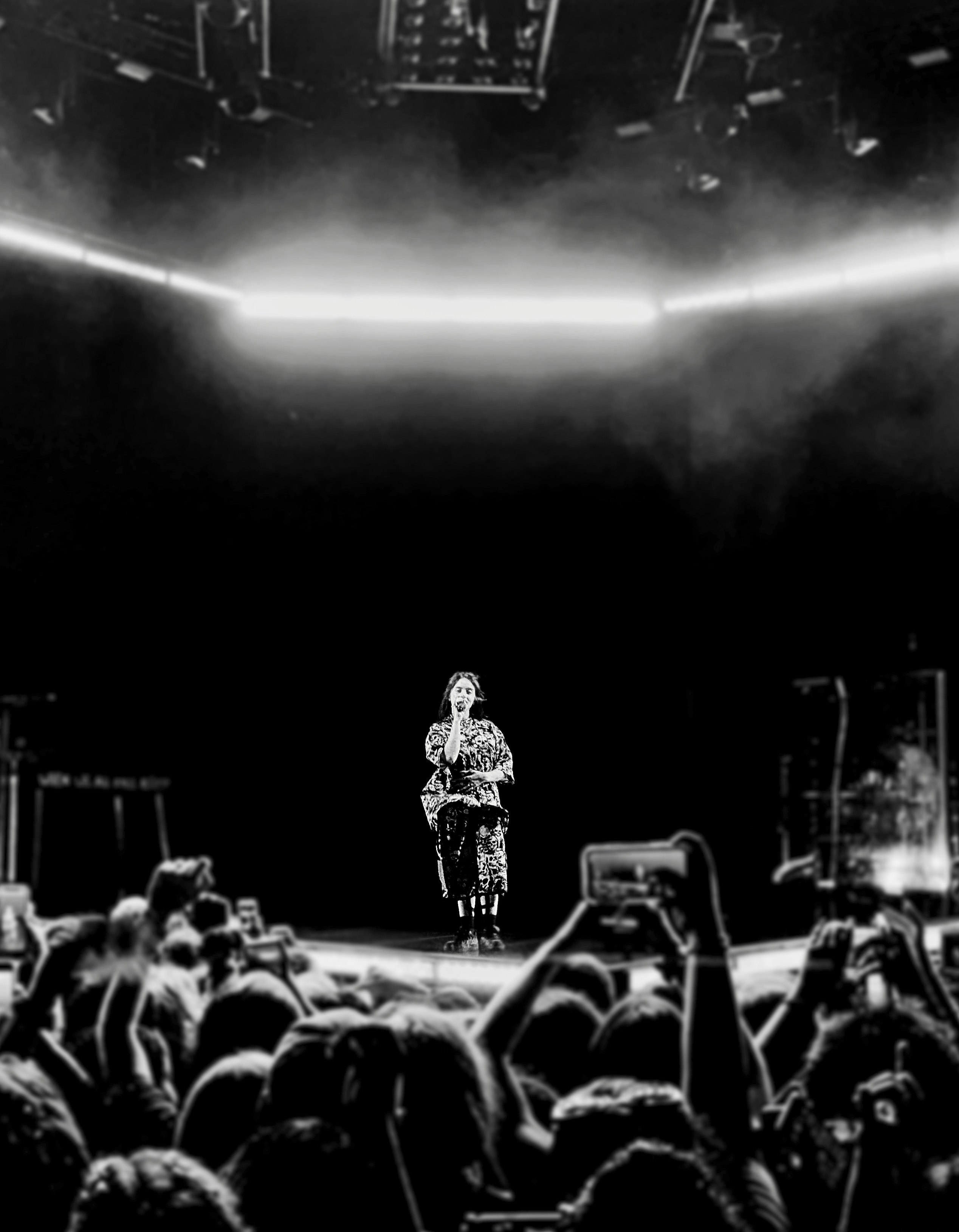 greyscale photography of person performing on stage